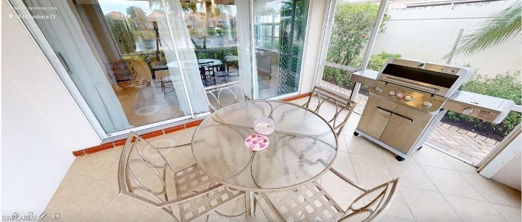 Sunroom / solarium with tile patterned flooring and healthy amount of natural light