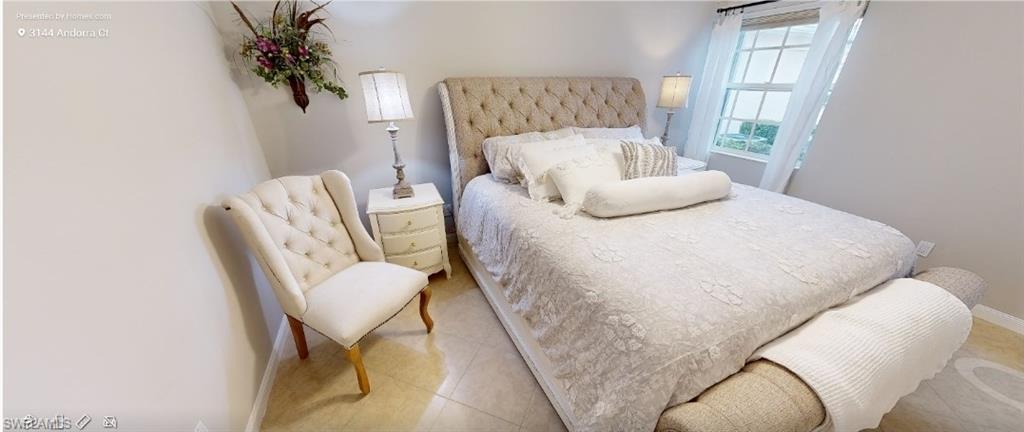 Bedroom featuring baseboards and tile patterned floors