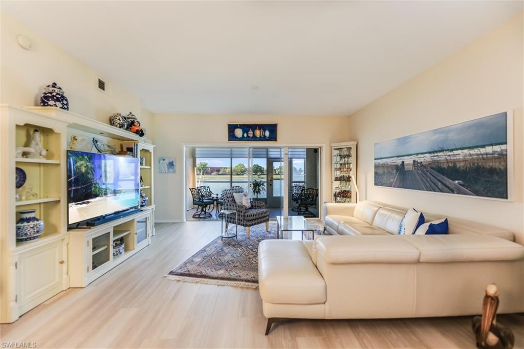 Living area featuring visible vents and light wood-style flooring