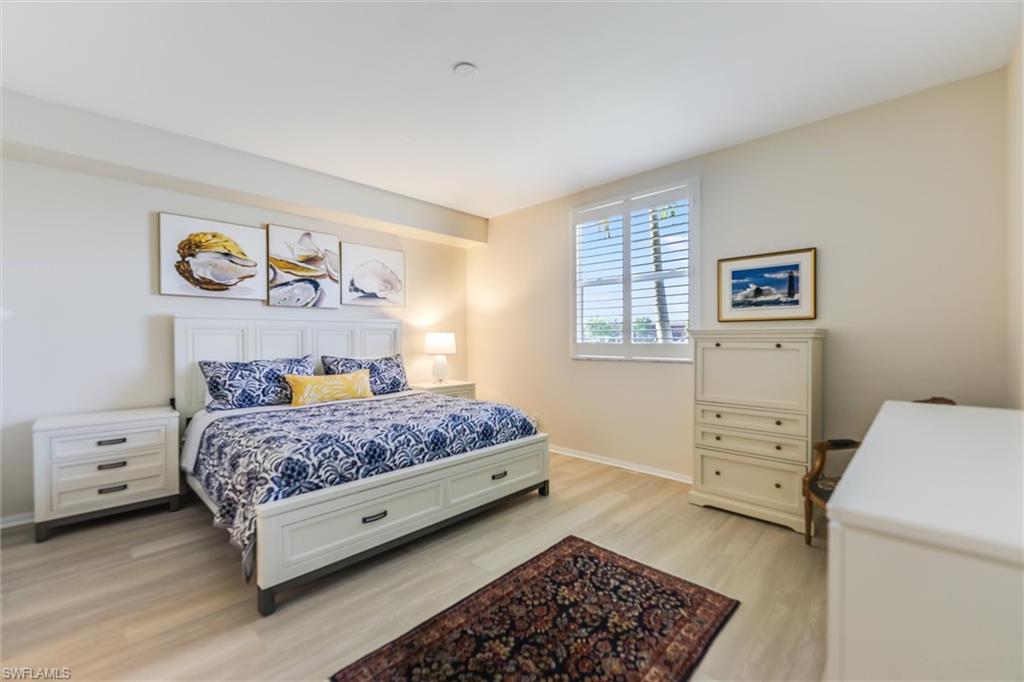 Bedroom featuring light wood-style flooring and baseboards