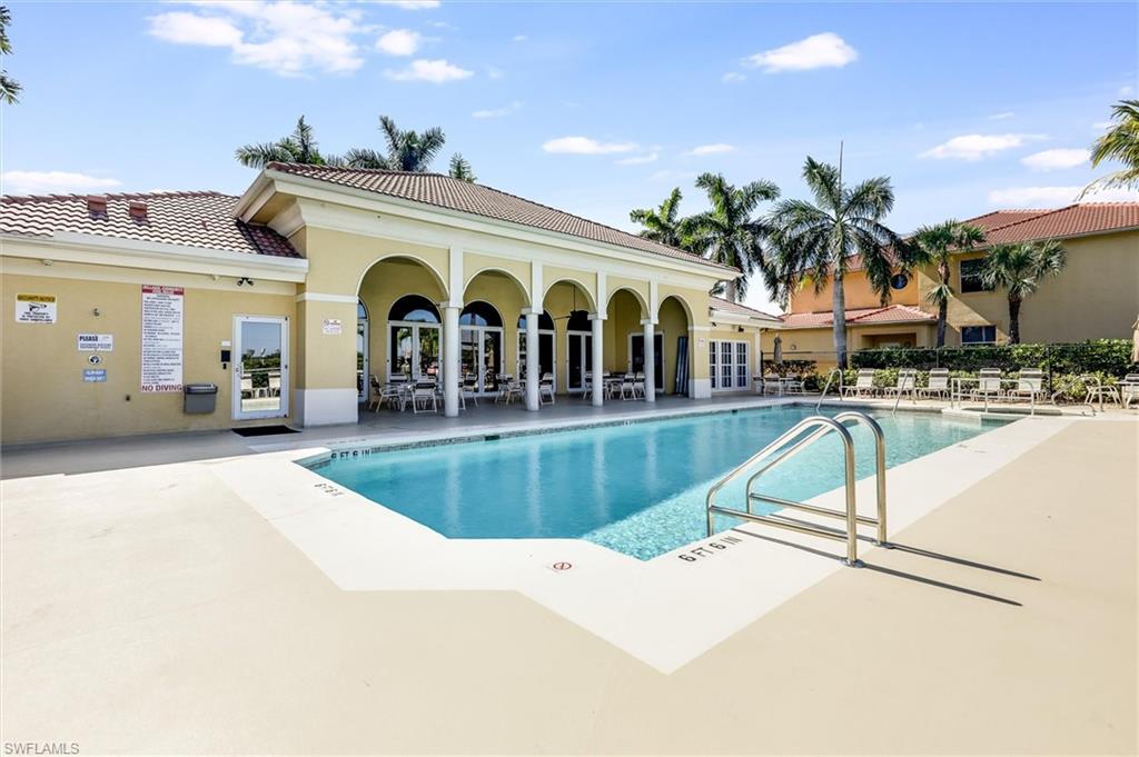 Community pool featuring a patio