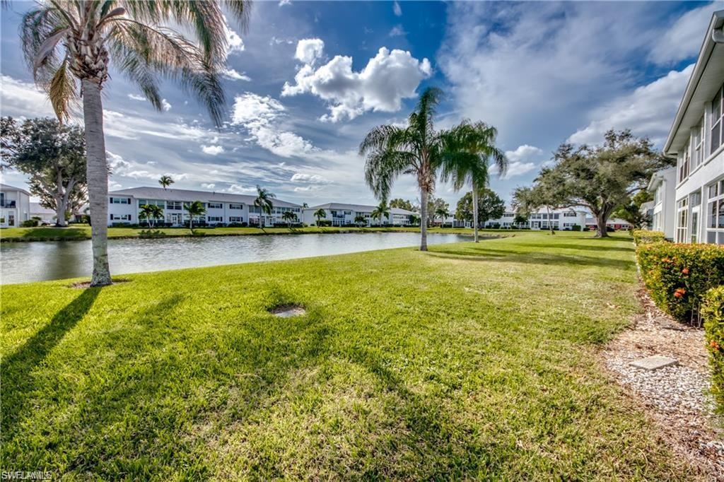 View of yard with a water view and a residential view