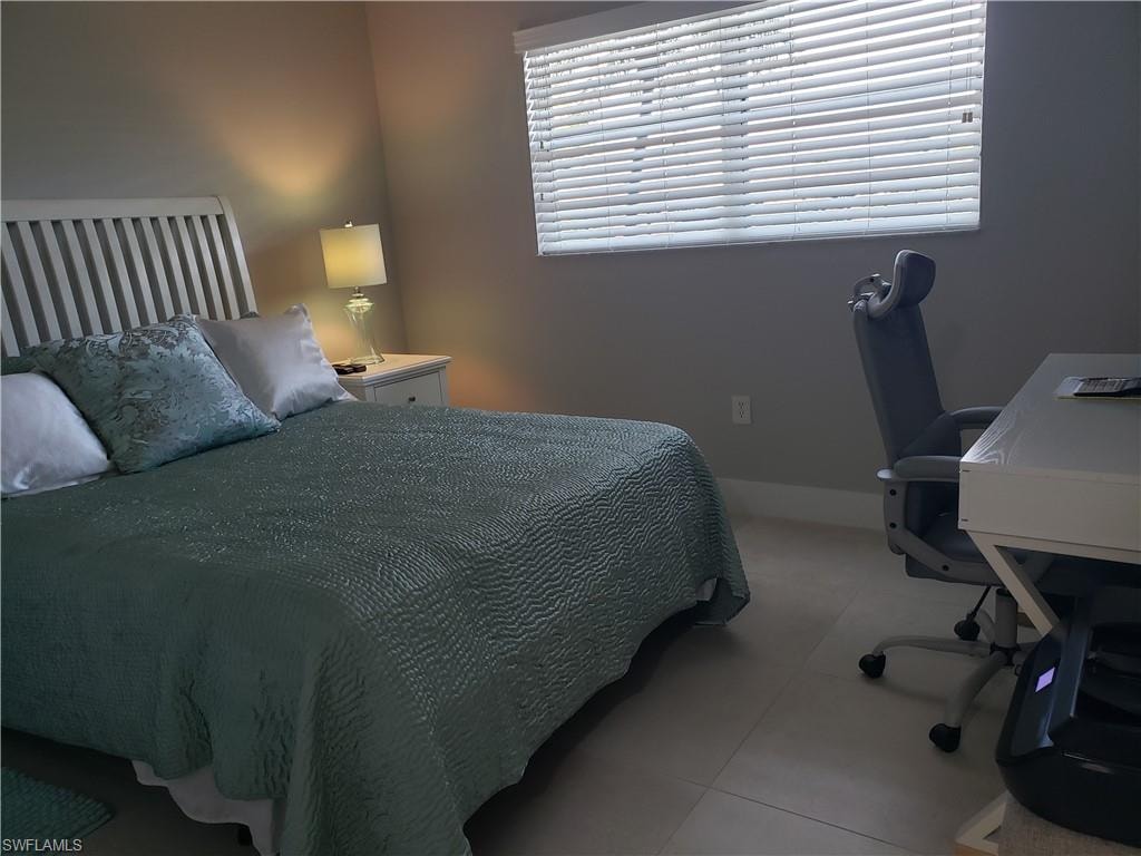 guest bedroom suite has a pocket door to close off bathroom and bedroom from main living area