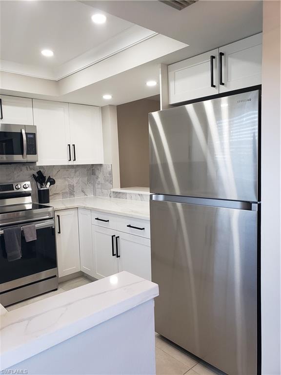 Kitchen has trayed ceiling with extra lighting