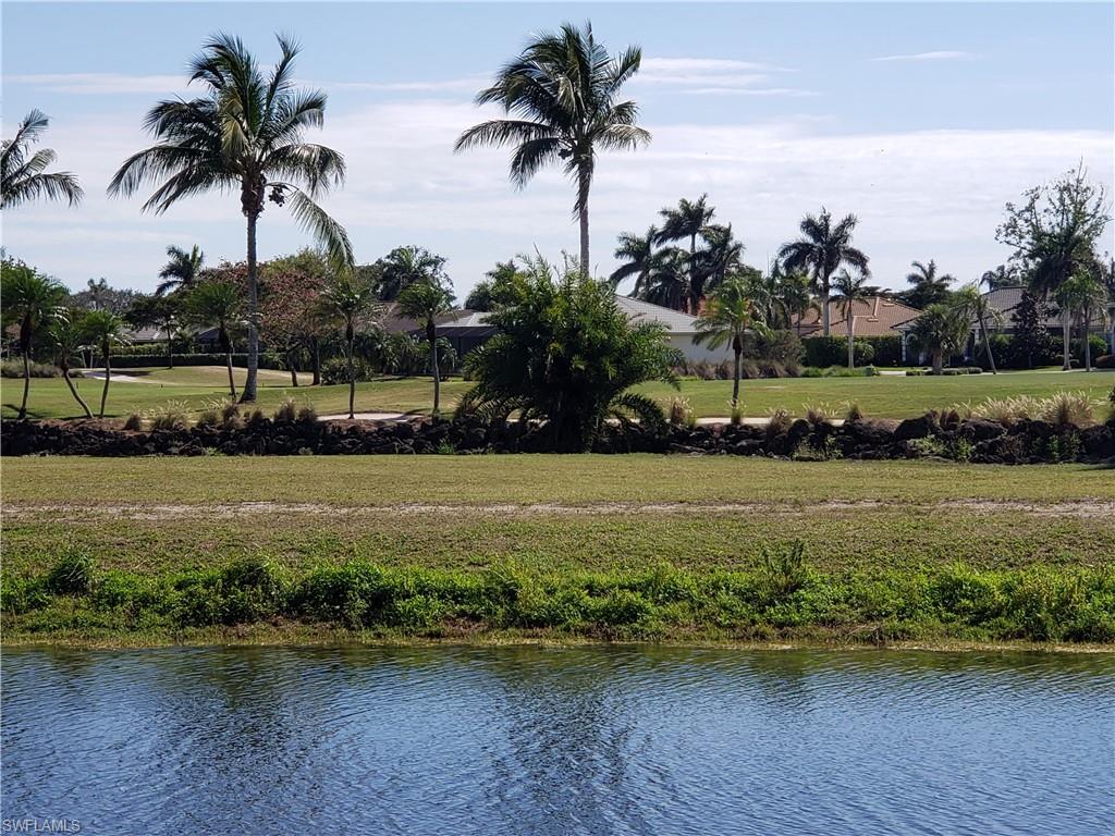 Water and golf course view from screened lanai