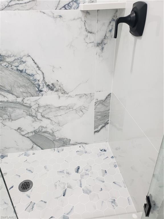 Interior details of guest bathroom shower.  Custom glass and door entry