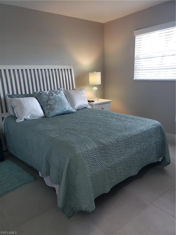 Guest Bedroom suite with tile floor