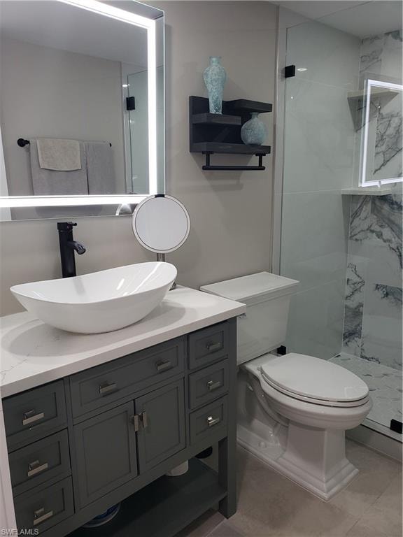 Guest bathroom vanity has vessel sink with lighted mirror