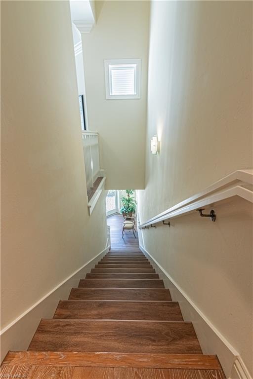 Stairway featuring baseboards
