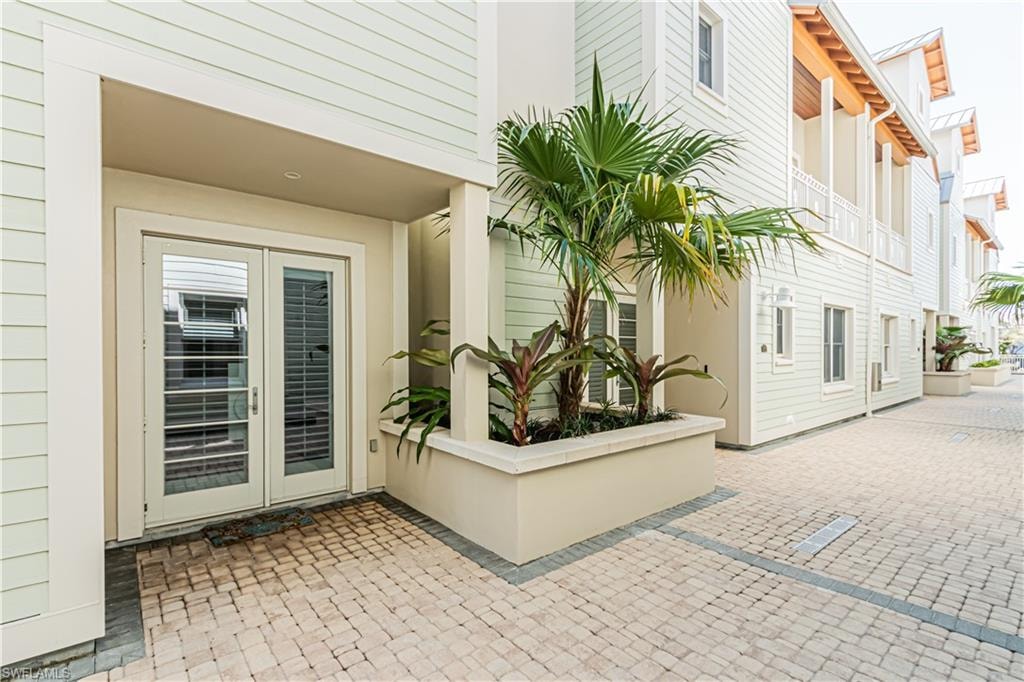 Doorway to property featuring a patio area
