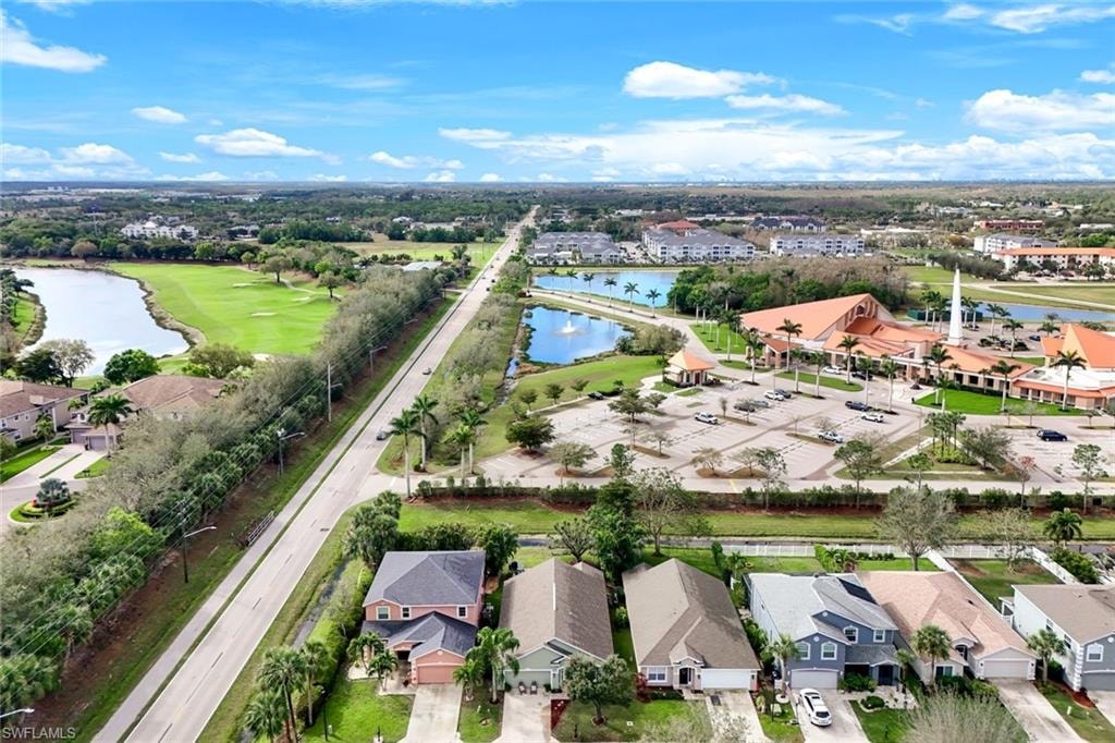 Drone / aerial view featuring a water view and a residential view