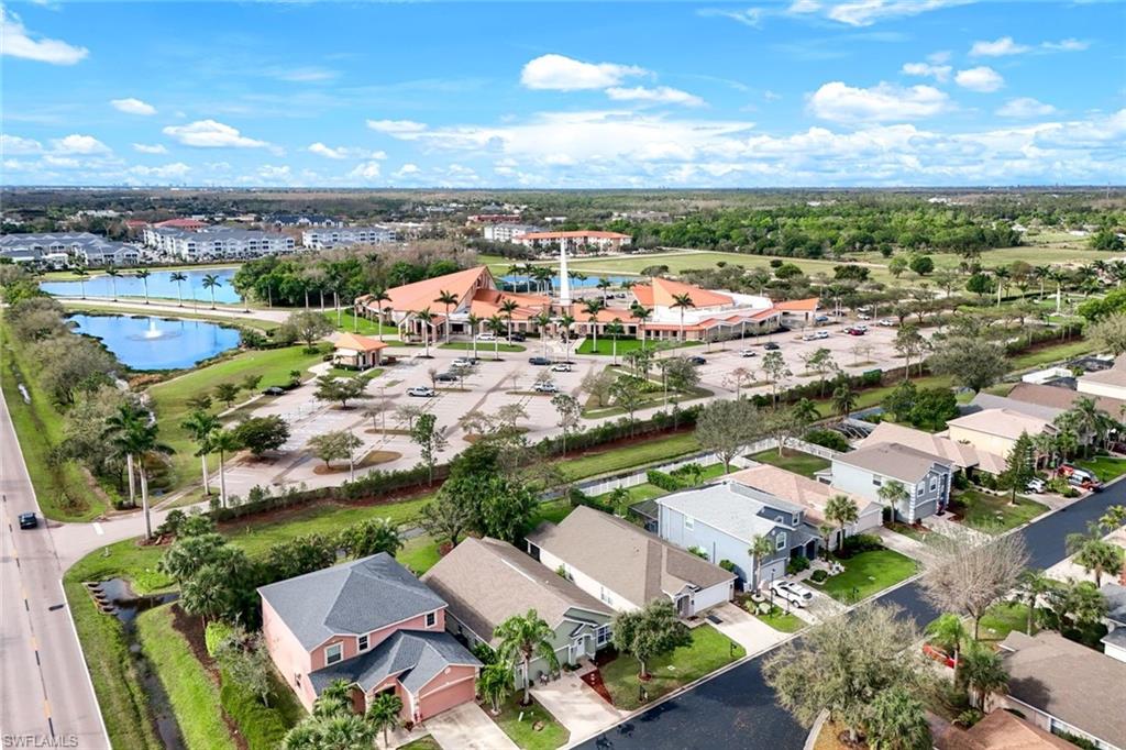 Drone / aerial view featuring a water view and a residential view
