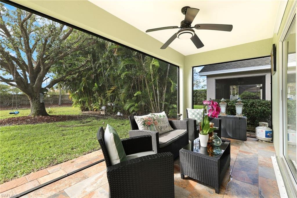 Sunroom / solarium featuring a ceiling fan