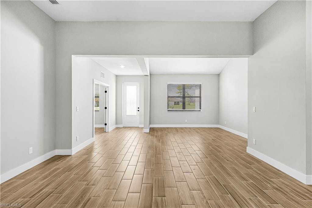 Spare room with wood finish floors and baseboards