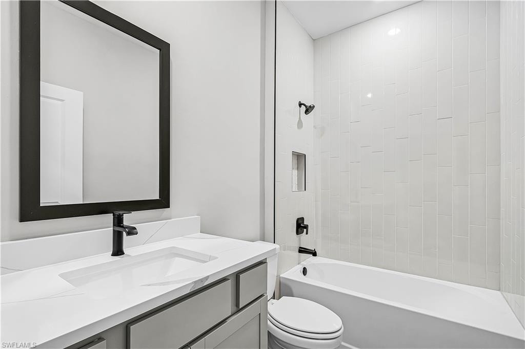 Full bathroom featuring bathtub / shower combination and vanity