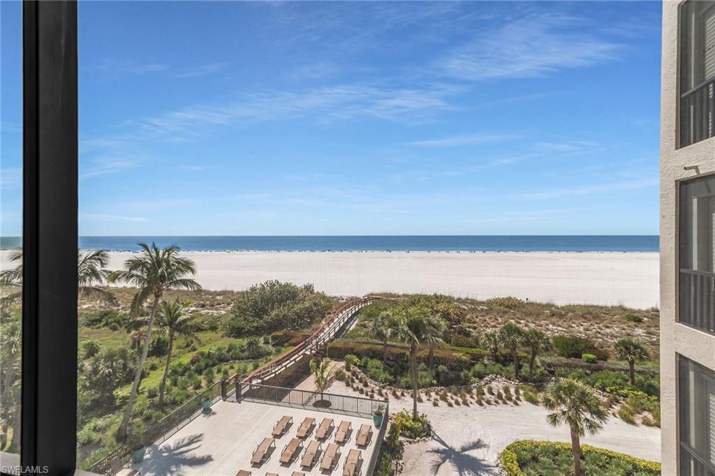 Property view of water featuring a beach view