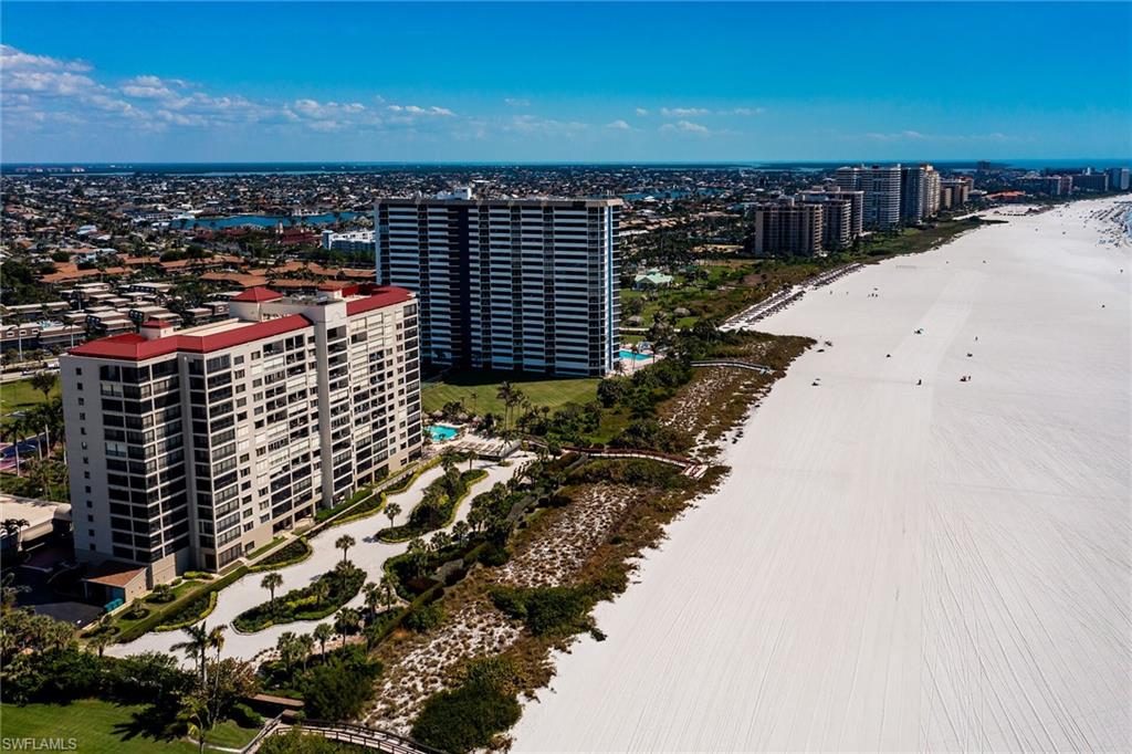 Birds eye view of property with a view of city and a water view