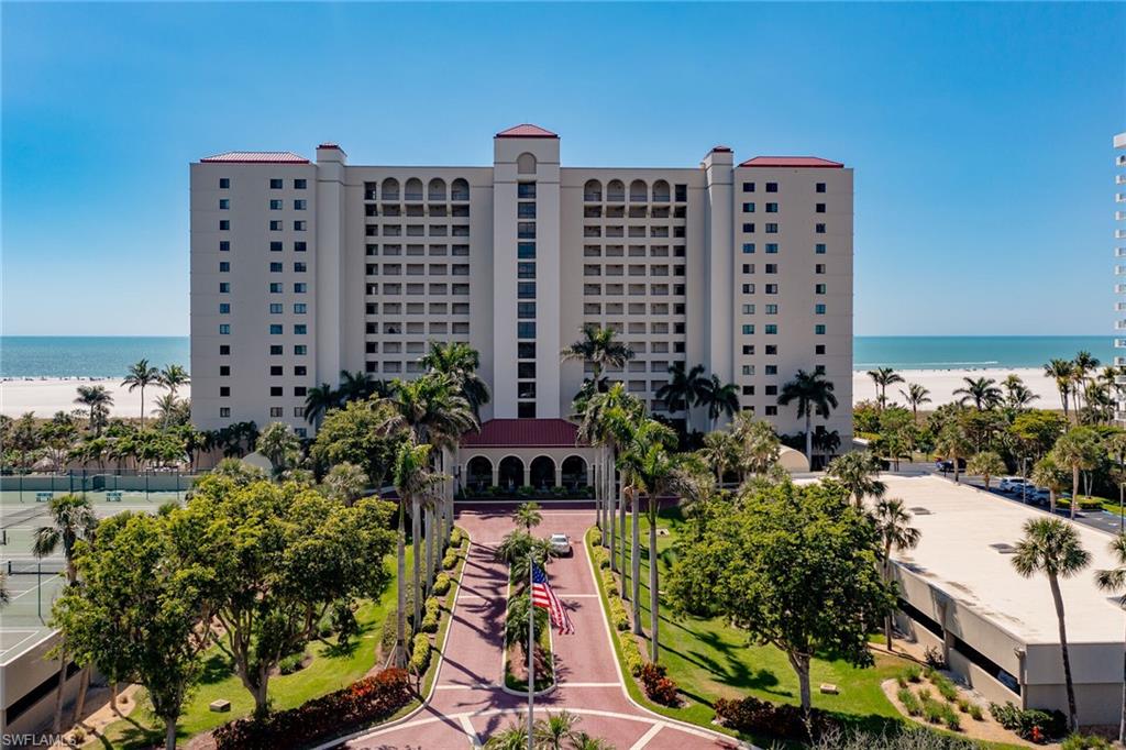 View of building exterior with a view of the beach and a water view