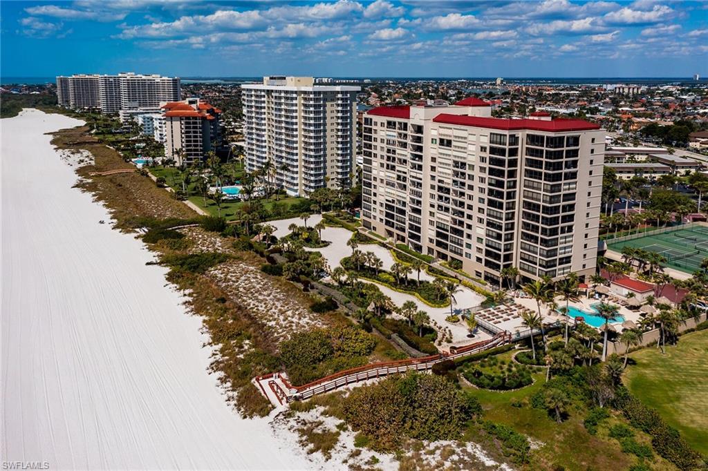 Birds eye view of property featuring a water view and a view of city
