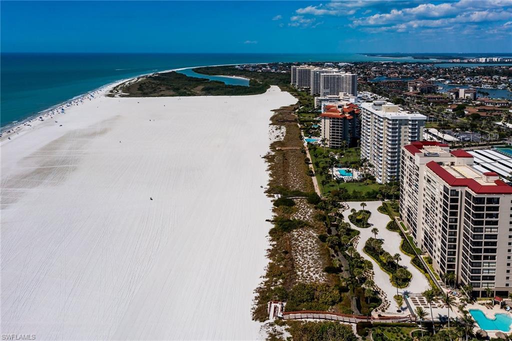 Aerial view with a view of city, a water view, and a view of the beach