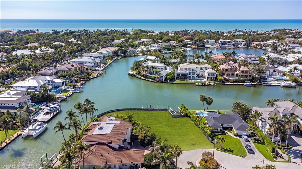 Aerial perspective of suburban area with a nearby body of water