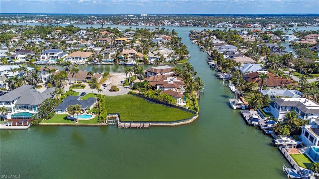 Aerial view of residential area with a large body of water