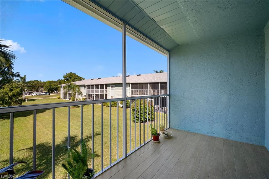 Balcony featuring a sunroom