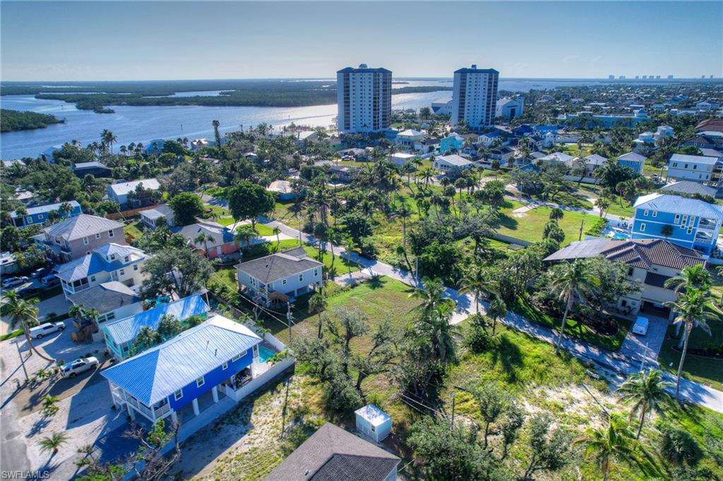 Aerial view of residential area featuring a large body of water
