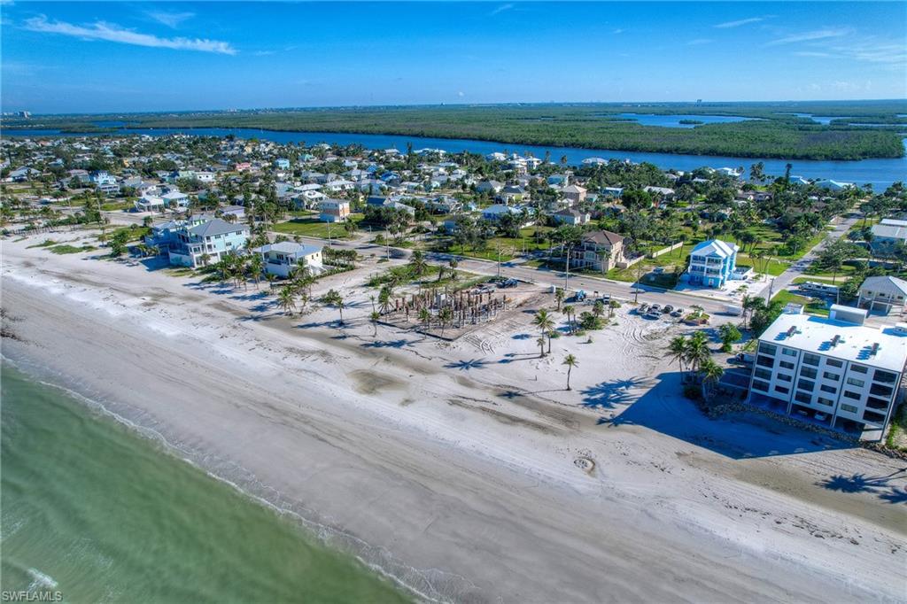 Aerial perspective of suburban area featuring unending shoreline
