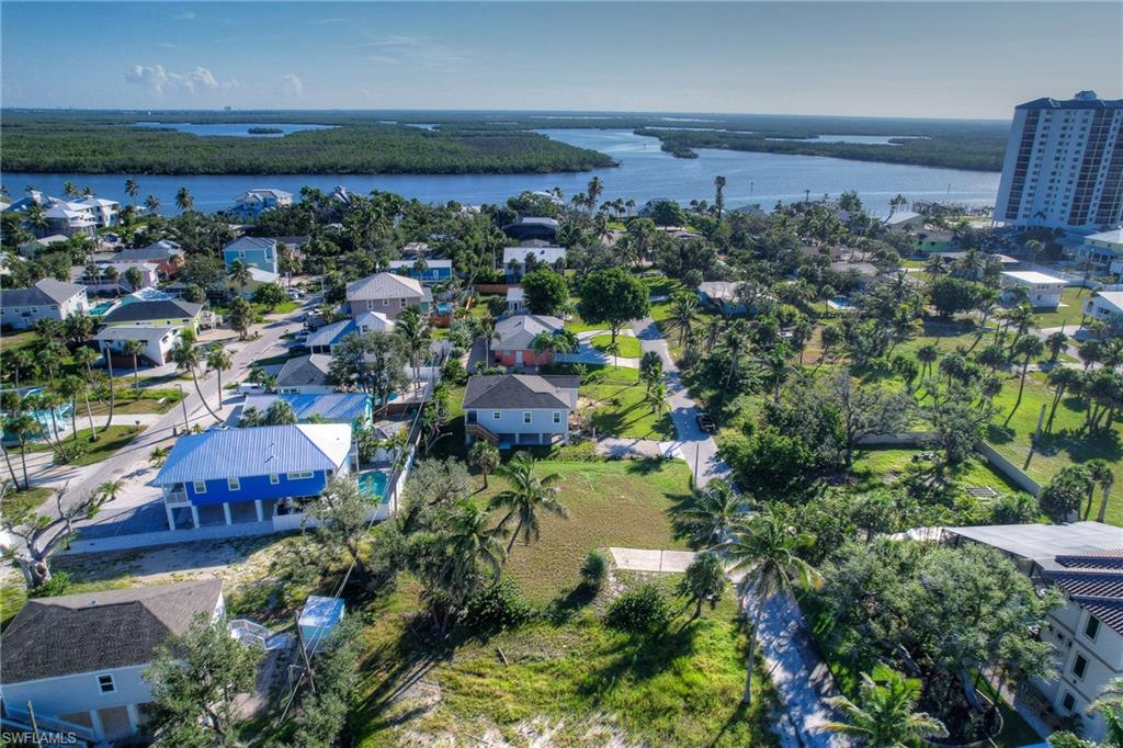 Aerial perspective of suburban area with a large body of water