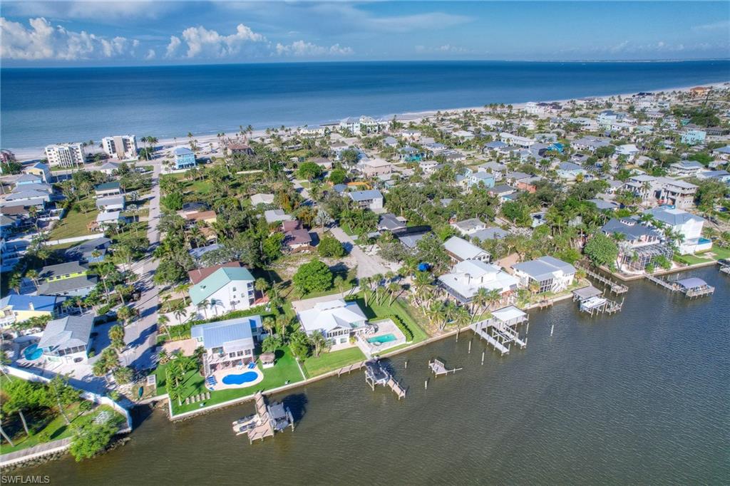 View of property location featuring a large body of water and nearby suburban area