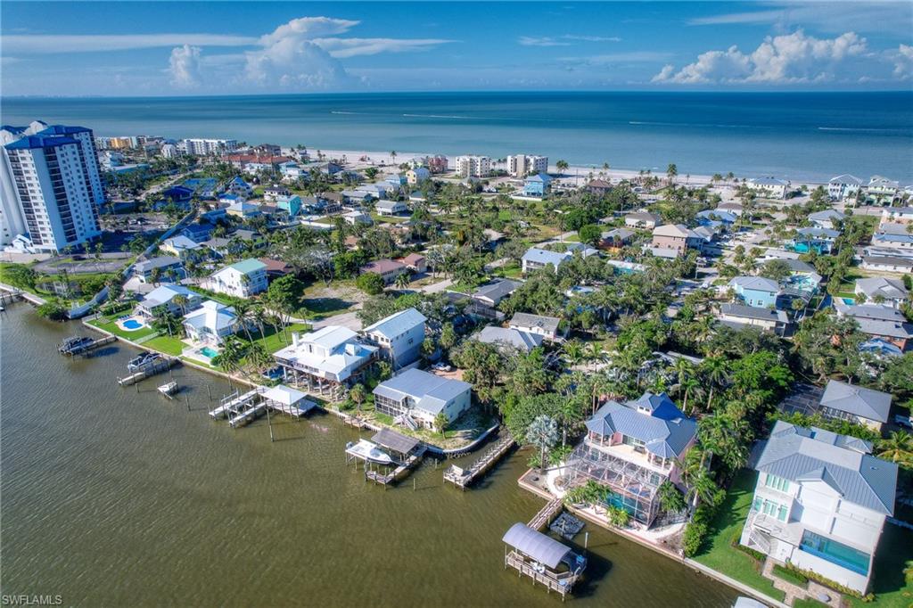 View of property location with a nearby body of water and nearby suburban area