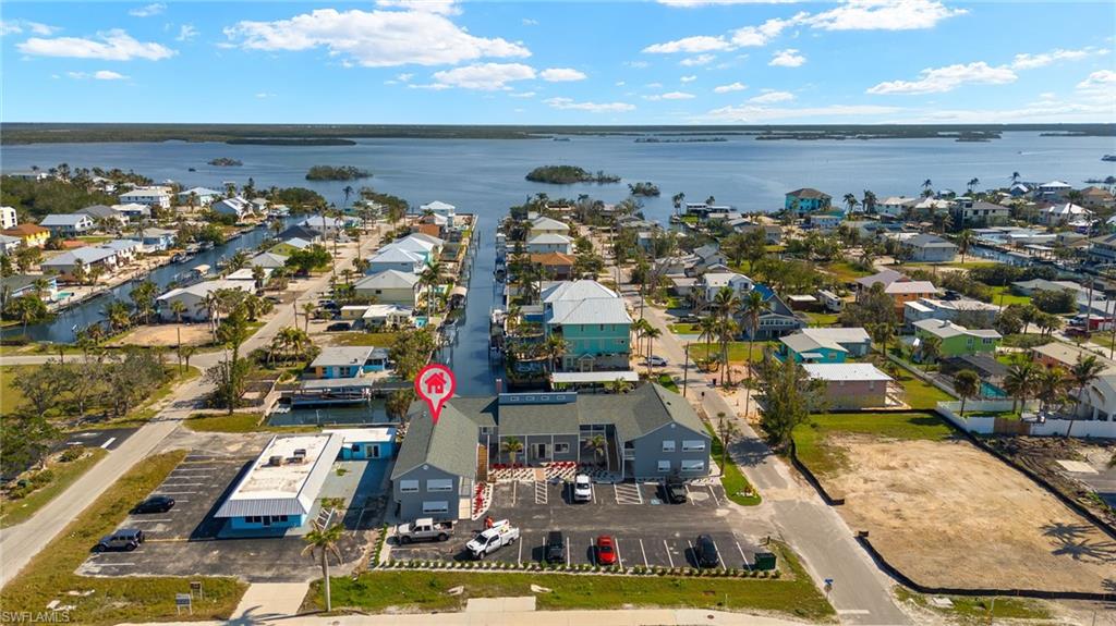 Aerial view featuring a water view and a residential view