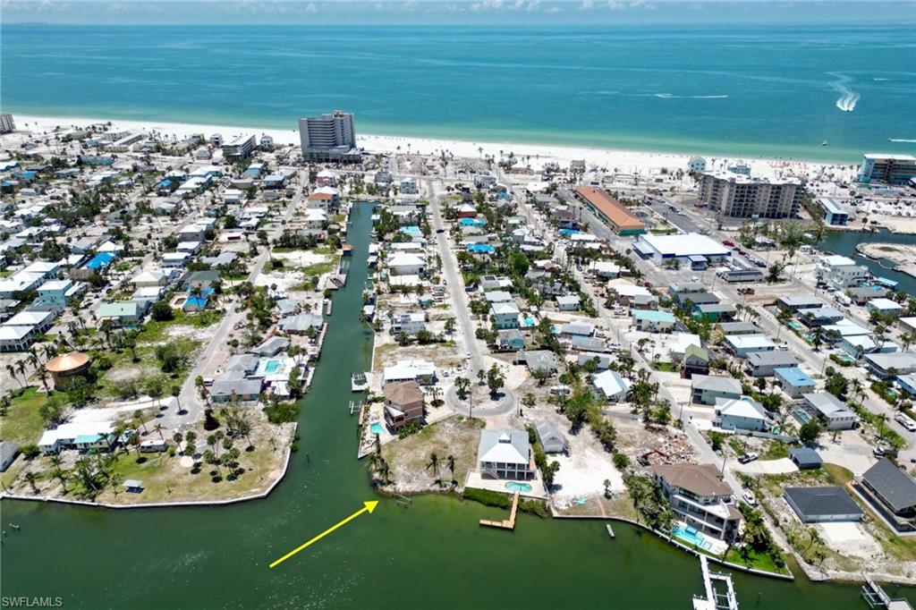 Drone / aerial view with a view of city and a water view