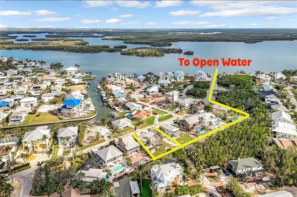 Bird's eye view featuring a water view and a residential view