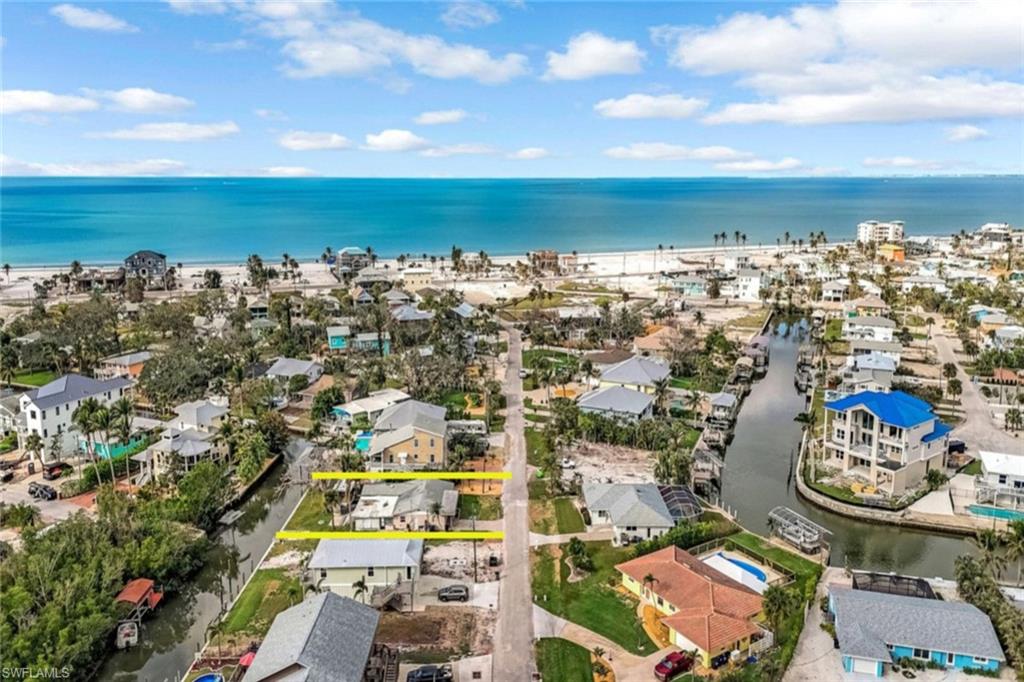 Drone / aerial view featuring a water view and a residential view