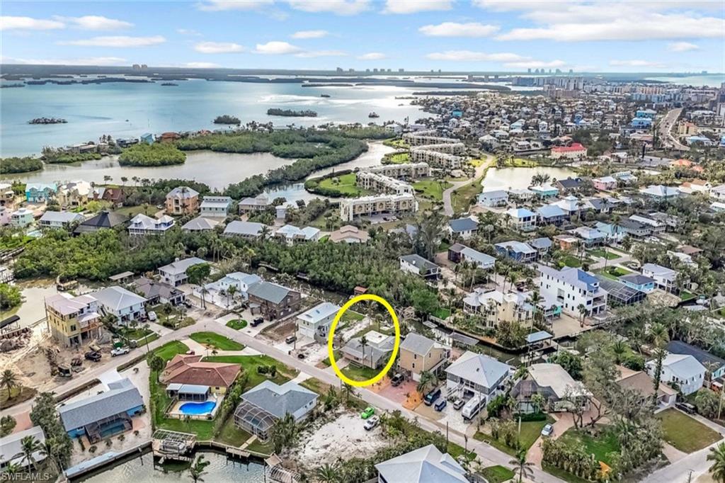 Drone / aerial view featuring a water view and a residential view