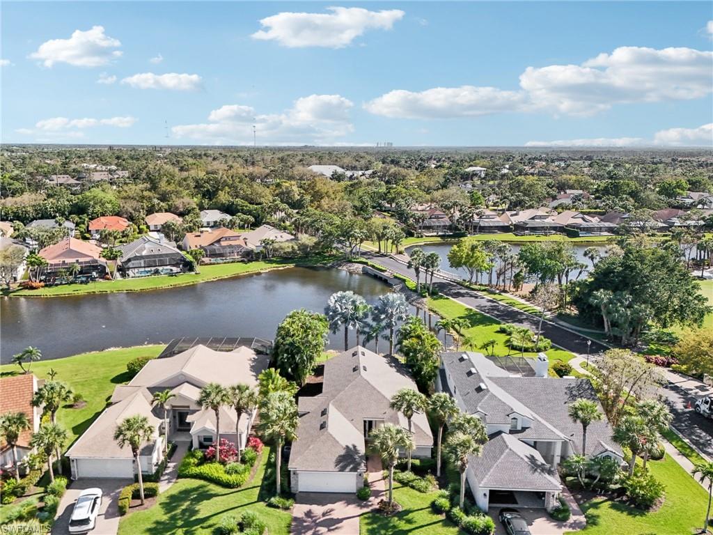 Aerial view featuring a residential view and a water view
