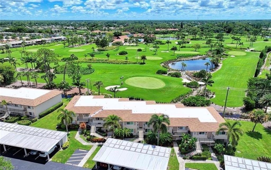 Aerial view featuring golf course view, canal view, and a residential view