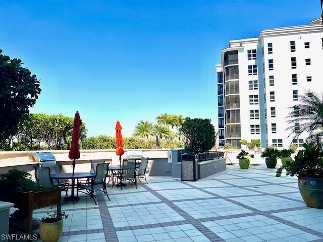 View of patio / terrace with an outdoor kitchen and outdoor dining area
