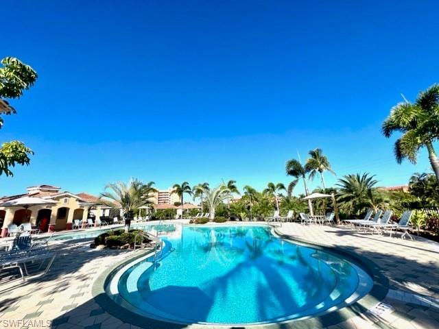 Community pool featuring a patio area