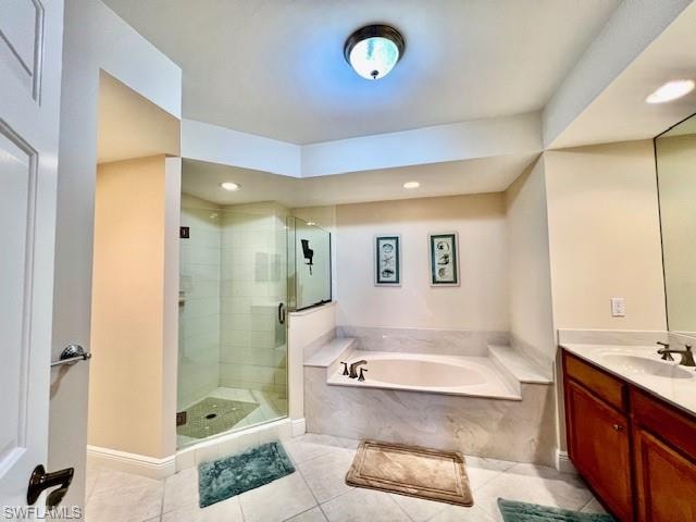 Full bath featuring vanity, recessed lighting, tile patterned flooring, a shower stall, and a garden tub
