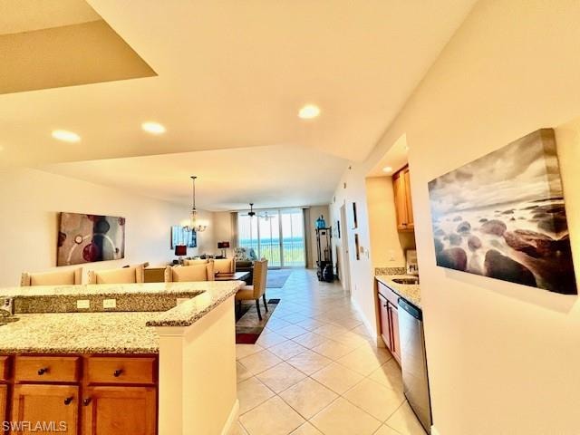Kitchen with light tile patterned floors, open floor plan, recessed lighting, and dishwasher