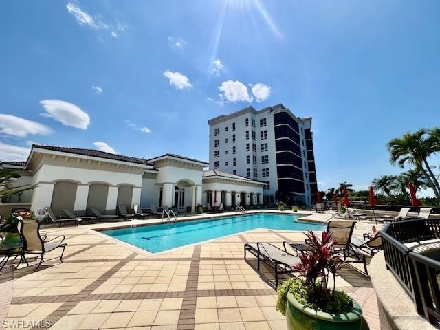 Community pool featuring a patio area