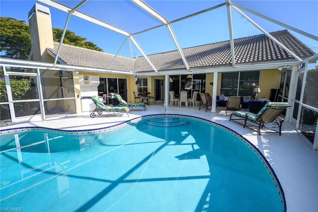 Outdoor pool featuring screen enclosure with all new screens, plenty of undercover entertaining space.