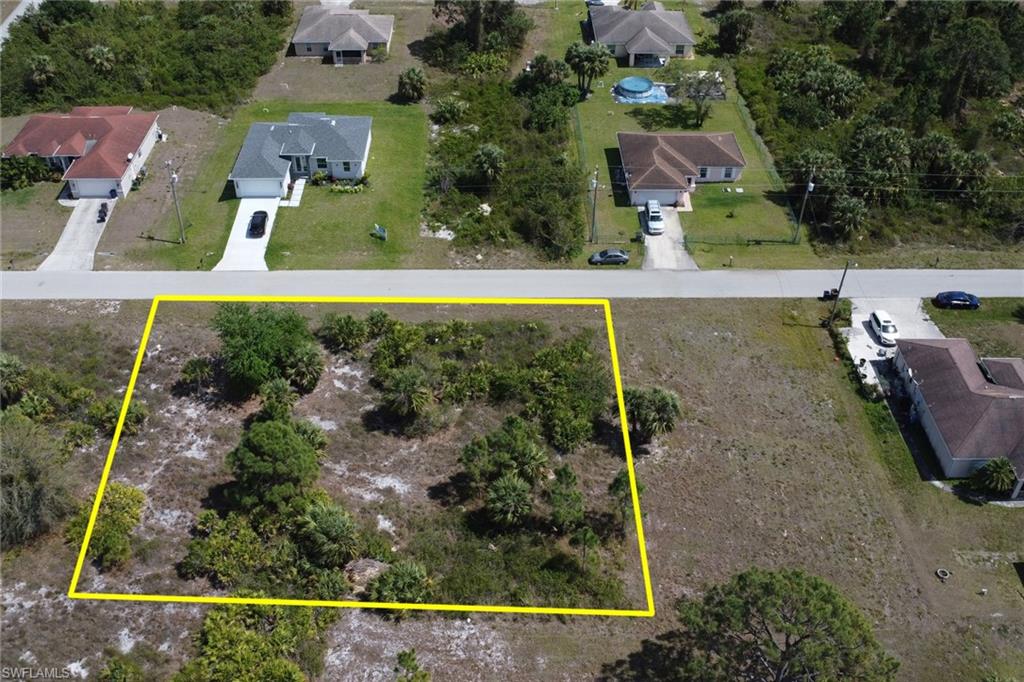 Birds eye view of property with a residential view
