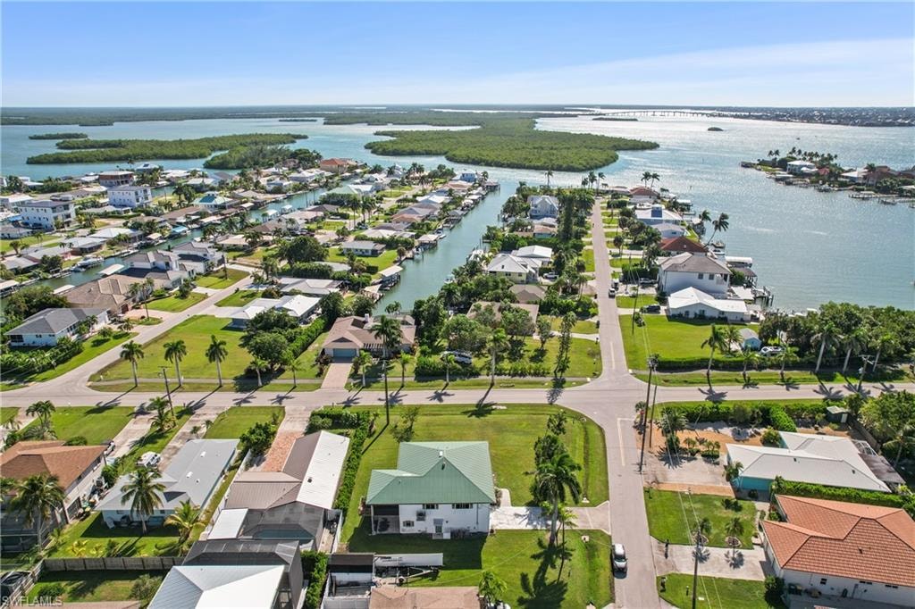 Aerial view of residential area with a large body of water