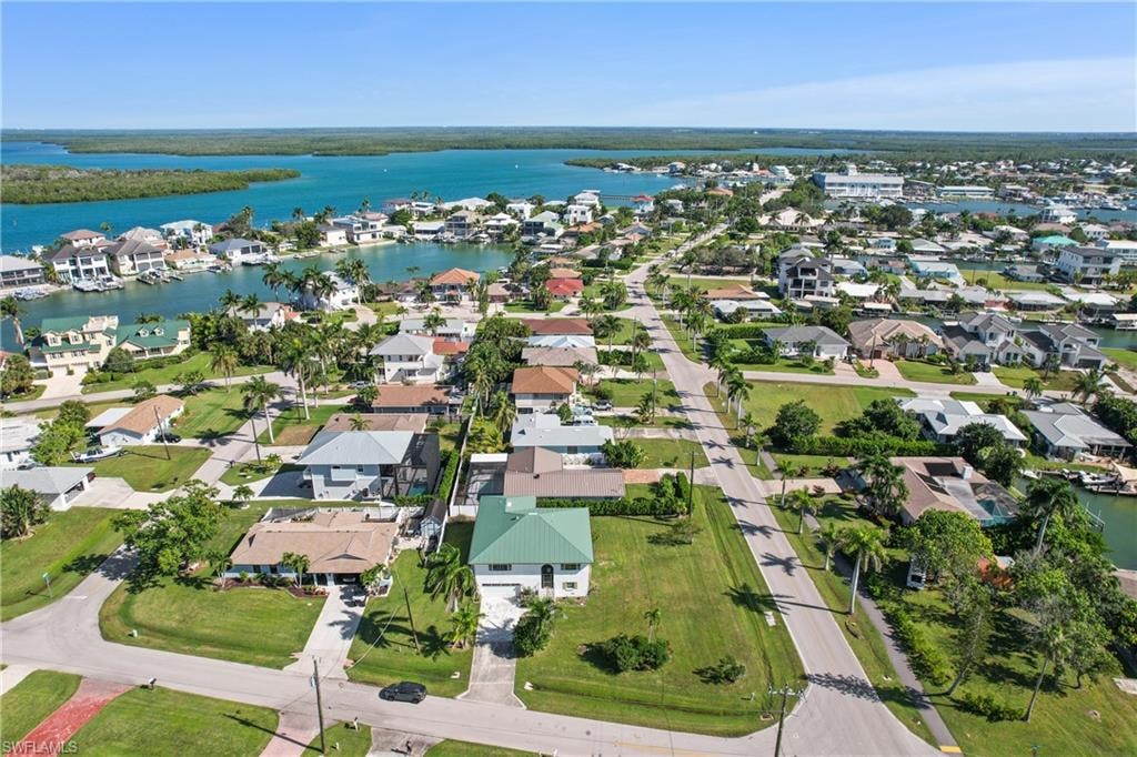 View of property location with nearby suburban area and a large body of water