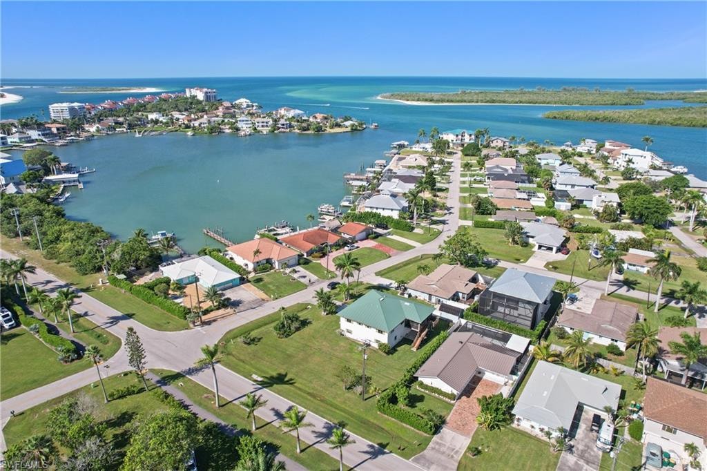View of property location with a nearby body of water and nearby suburban area