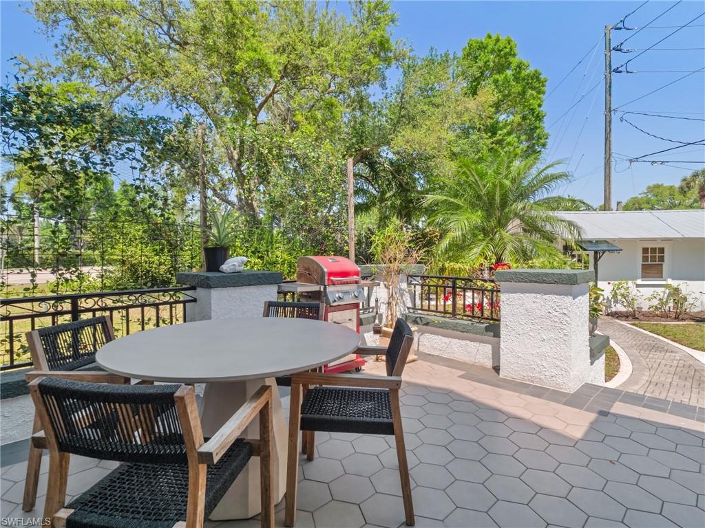 Designed for entertaining, the outdoor living area offers ample space for dining, grilling, and gathering with friends and family.